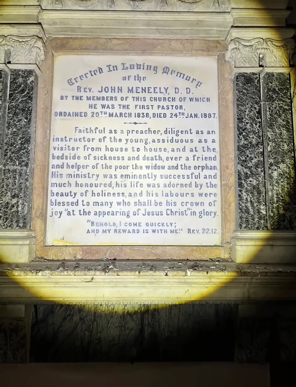 A marble memorial plaque to Rev. John Meneely, D.D., the congregation’s first pastor